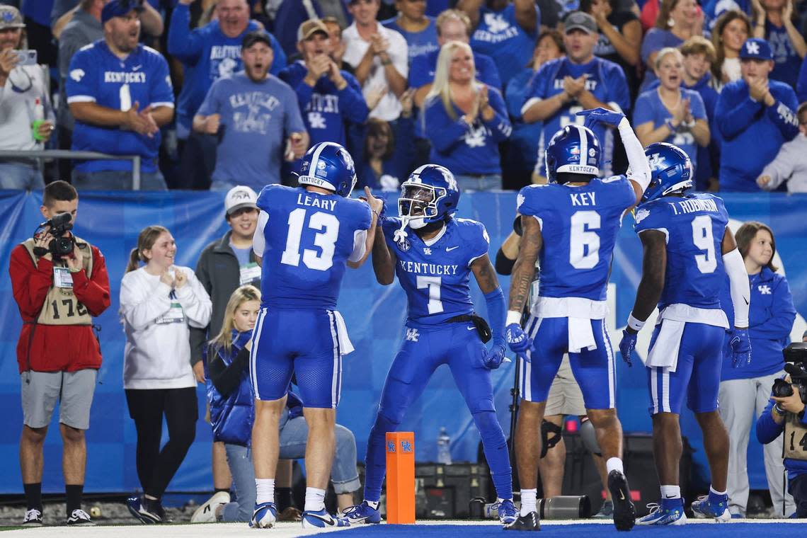 Kentucky wide receiver Barion Brown (7) celebrates with quarterback Devin Leary (13) after scoring a touchdown against Tennessee in the second quarter during Saturday’s game at Kroger Field. Silas Walker/swalker@herald-leader.com