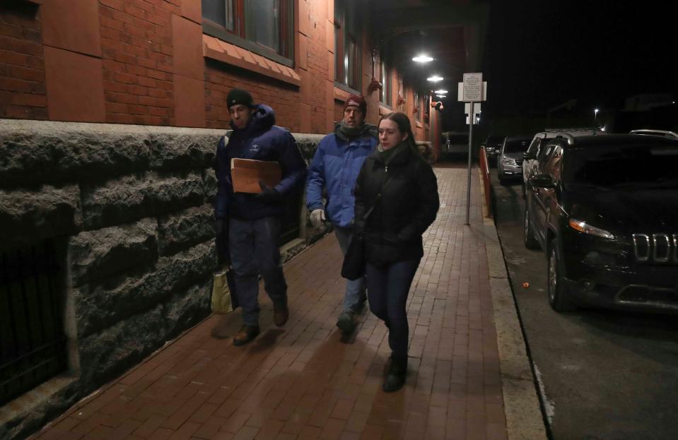 A group of volunteers, including Scott Siegel (left) and Maddie Brooks of Christiana Care (right) and Stephen Metraux of the University of Delaware's School of Public Policy and Administration, head into the Joseph R. Biden Jr. Railroad Station in Wilmington as they look for homeless people while performing a count and survey in 2020.