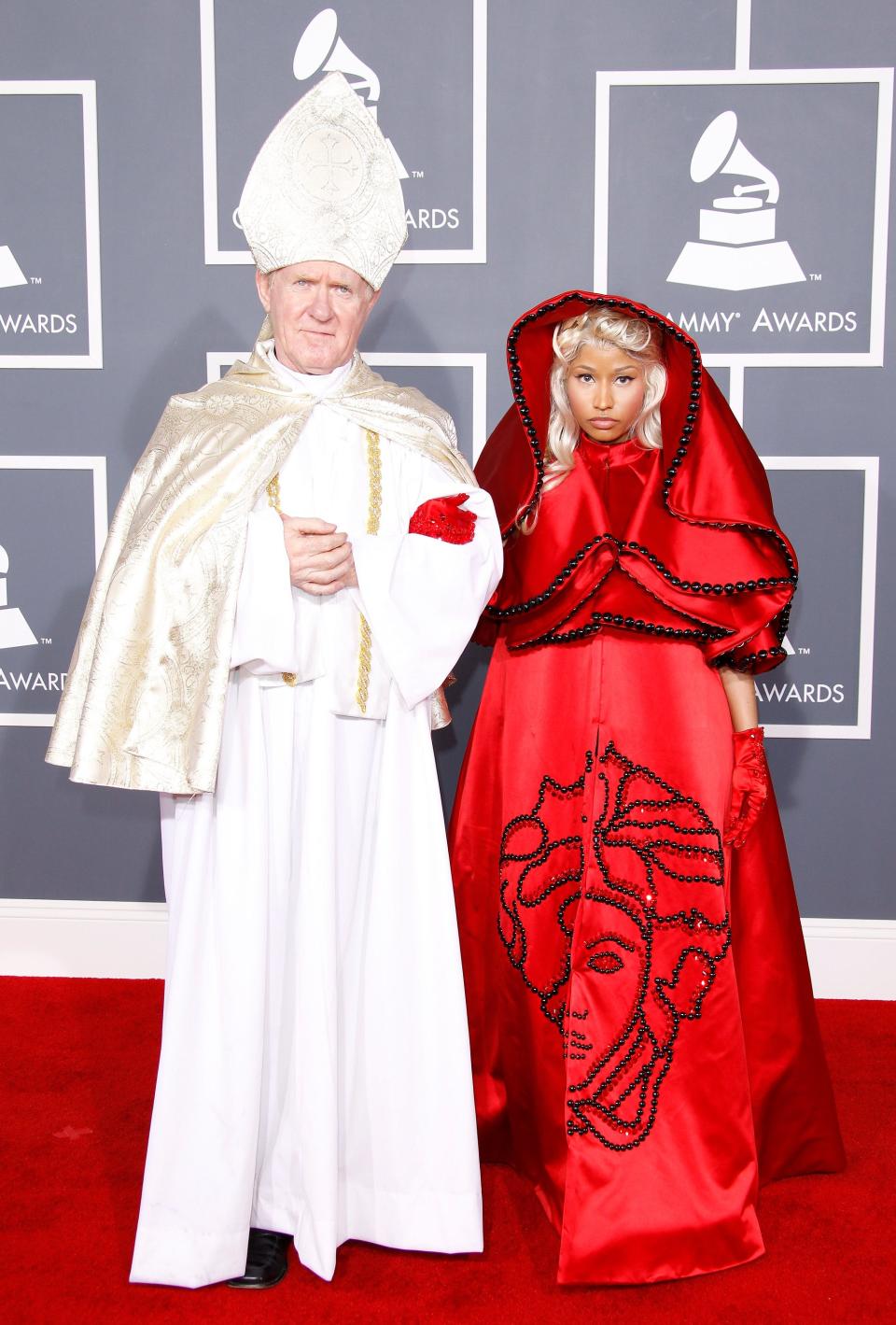 Nicki Minaj at the 2012 Grammy Awards wearing red Catholic robes