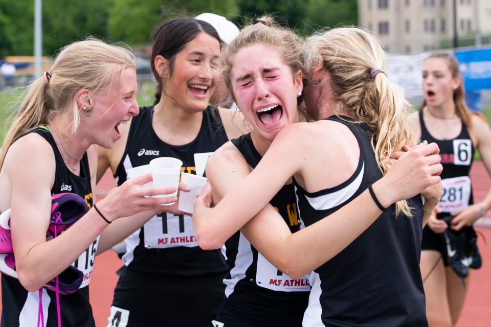 CB West sophomore Mimi Duffy cries as she hugs senior Kate Edenson after the quartet from Doylestown won the 3A girls' 4x800-meter relay at the PIAA Track and Field Championships at Shippensburg University on Saturday, May 28, 2022.