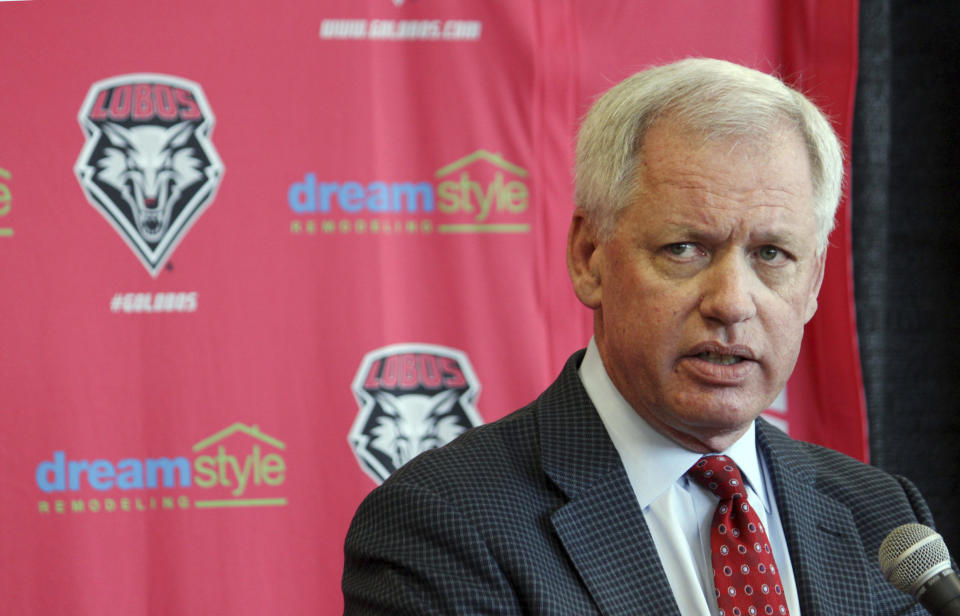 FILE - In this May 3, 2017, file photo, then-University of New Mexico athletics director Paul Krebs answers questions during a news conference in Albuquerque, N.M. Krebs has been charged with fraud and money laundering. The New Mexico Attorney General's Office filed a criminal complaint Wednesday, Feb. 6, 2019, against Krebs in connection with a 2015 golf trip to Scotland and allegations he tried to conceal a $25,000 donation. (AP Photo/Susan Montoya Bryan, File)