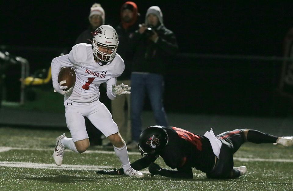 Ballard defensive back Tucker Vitzthum (1) runs with the ball after intercepting a pass during Friday's game at North Polk.