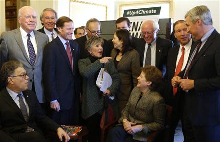 U.S. Senators from the Senate Climate Action Task Force gather before holding the Senate floor to urge action on climate change, on Capitol Hill in Washington March 10, 2014. REUTERS/Yuri Gripas