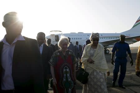 Freed hostage Jocelyn Elliott (C), who was kidnapped with her husband in Burkina Faso by a group affiliated to al Qaeda, arrives in Ouagadougou, Burkina Faso, February 8, 2016. REUTERS/Nabila El Hadad