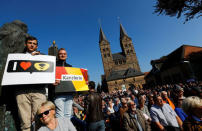 Supportes of German Chancellor Angela Merkel, a top candidate of the Christian Democratic Union Party (CDU) for the upcoming general elections, are seen at an election rally in Fritzlar, Germany September 21, 2017. REUTERS/Kai Pfaffenbach