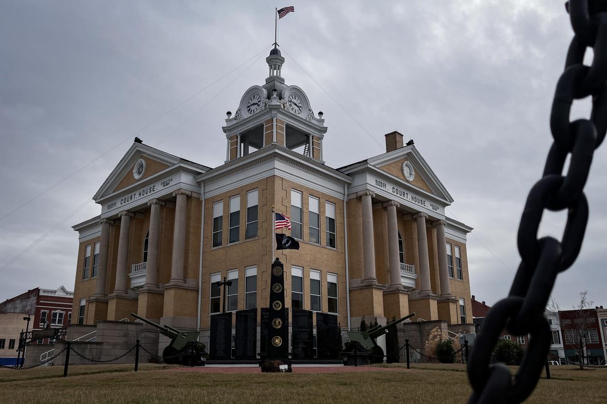 Low-hanging clouds surround the old Warrick County Courthouse in Boonville, Indiana, after the state police arrested the county's three commissioners Thursday, Feb. 9, 2024.