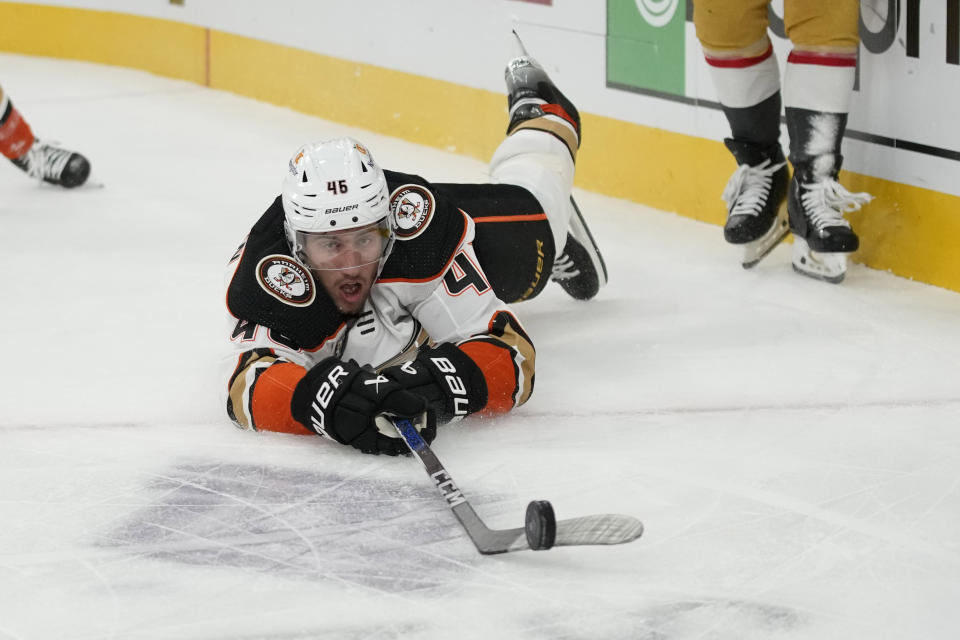 Anaheim Ducks defenseman Ilya Lyubushkin (46) slides across the ice towards the puck during the second period of an NHL hockey game against the Vegas Golden Knights, Saturday, Oct. 14, 2023, in Las Vegas. (AP Photo/John Locher)