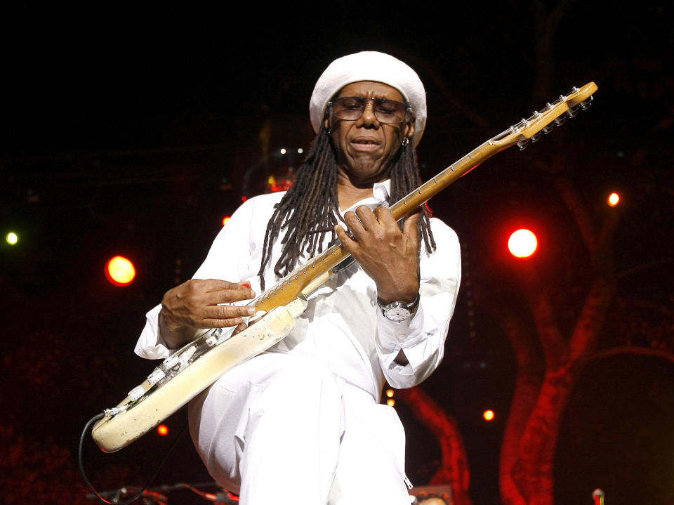 FILE - Guitarist Nile Rodgers of Chic performs at the Jazz Festival of 5 Continents, in Marseille, southern France, July 20, 2013. Hip-hop is, simply, “a magical art form,” says Rodgers, legendary musician, composer and record producer. He would know. It was his song “Good Times,” with the band Chic, that was recreated to form the basis for “Rapper's Delight” all those years ago.“The impact that it’s had on the world, it really can’t be quantified,” Rodgers says. “You can find someone in a village that you’ve never been to, a country that you’ve never been to, and all of a sudden you hear its own local hip-hop. And you don’t even know who these people are, but they’ve adopted it and have made it their own.” (AP Photo/Claude Paris, file)