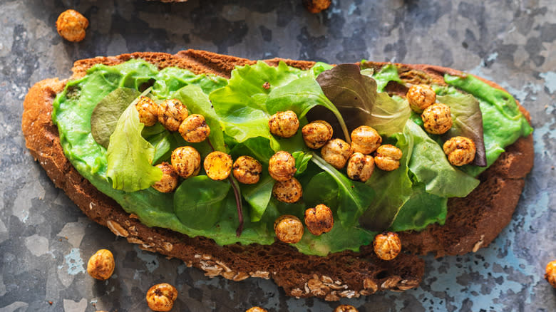 avocado hummus and chickpeas on toast