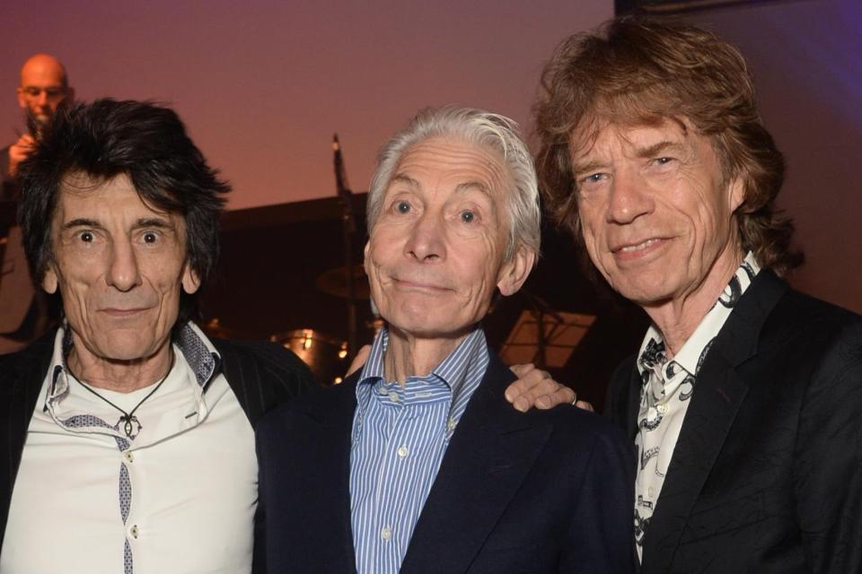 Charlie Watts (centre) with Ronnie Wood and Mick Jagger (PA)