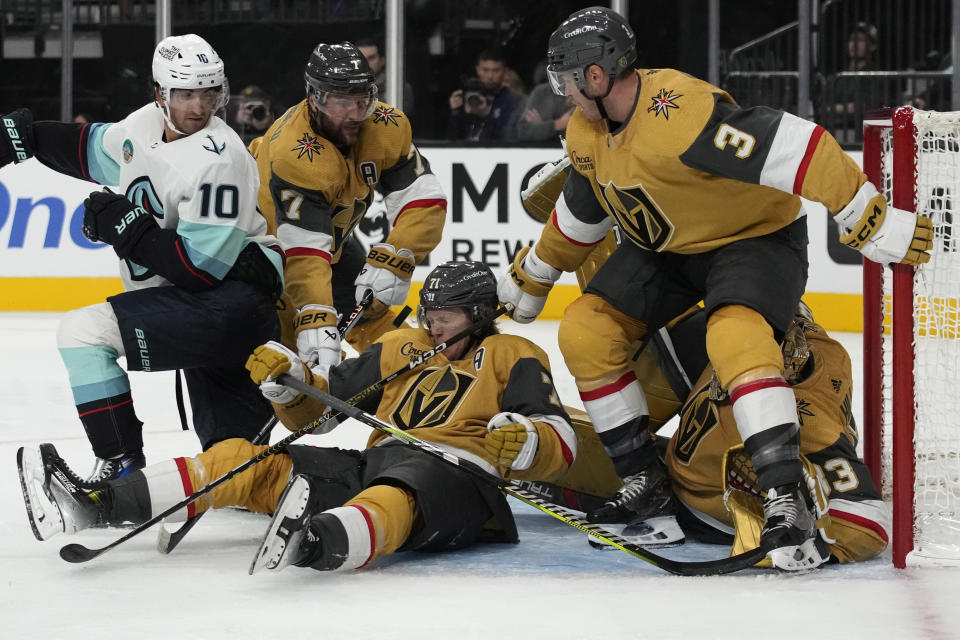 A shot by the Seattle Kraken bounces off Vegas Golden Knights center William Karlsson (71) during the third period of an NHL hockey game Tuesday, Oct. 10, 2023, in Las Vegas. (AP Photo/John Locher)