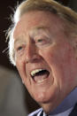 FILE - Vin Scully, the play-by-play announcer for the Los Angeles Dodgers, speaks to media during the Hollywood Radio and Television Society's Newsmaker Luncheon on Nov. 10, 2009 in Beverly Hills, Calif. Scully, whose dulcet tones provided the soundtrack of summer while entertaining and informing Dodgers fans in Brooklyn and Los Angeles for 67 years, died Tuesday night, Aug. 2, 2022, the team said. He was 94. (AP Photo/Nick Ut, File)