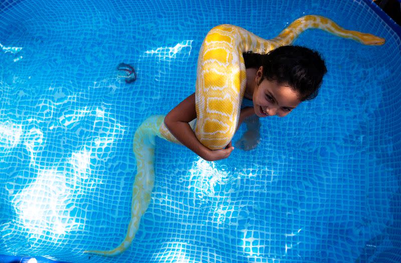 Israeli girl makes a splash with her pet snake