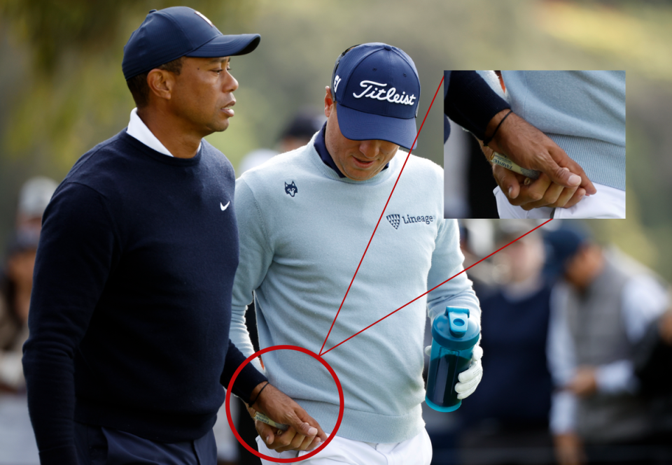 Tiger Woods hands Justin Thomas a tampon during the Genesis Invitational (Getty Images)