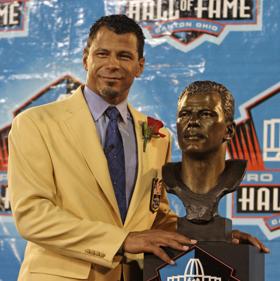 FILE - In this Saturday, Aug. 8, 2009 file photo, Former Pittsburgh Steelers, San Francisco 49ers, Baltimore Ravens and Oakland Raiders player Rod Woodson stands with his bronze bust during the Pro Football Hall of Fame induction ceremony at the Pro Football Hall of Fame in Canton, Ohio. The Pro Football Hall of Fame World Bowl Presented by Xenith will be at Azul Stadium, with players chosen by a selection team of scouts, Hall of Famers and former NFL executives. Rod Woodson, the outstanding defensive back and special teams player who entered the Hall of Fame in 2009 will serve as host.(AP Photo/Tony Dejak, File)