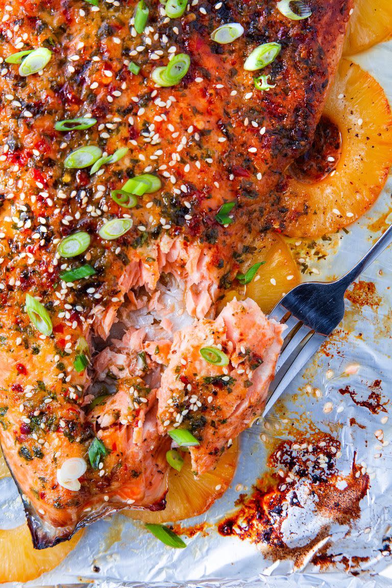 <p>Giving the salmon a quick grill at the end of cooking gives the marinade a chance to caramelise—it's too good. Just make sure to keep a close eye on it, so you don't overcook the salmon! Two to three minutes is all you need under a hot grill.</p><p>Get the <a href="https://www.delish.com/uk/cooking/recipes/a31973798/baked-pineapple-salmon-recipe/" rel="nofollow noopener" target="_blank" data-ylk="slk:Baked Pineapple Salmon;elm:context_link;itc:0;sec:content-canvas" class="link ">Baked Pineapple Salmon</a> recipe. </p>