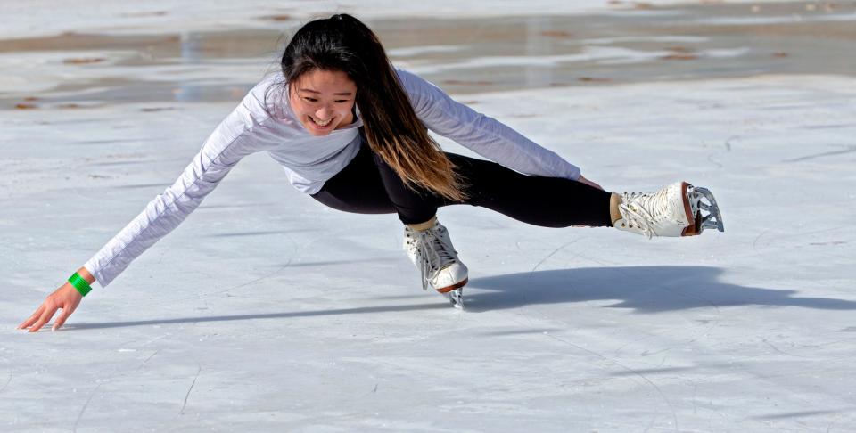 An ice skater practices her skills while enjoying the warm weather on Christmas Day in 2021 at the Devon Ice Rink in Oklahoma City.