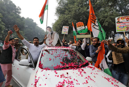 Supporters of India's main opposition Congress party celebrate after initial poll results at the party headquarters in New Delhi, India, December 11, 2018. REUTERS/Anushree Fadnavis