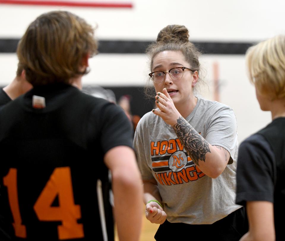North Canton Middle School 7th grade coach Briana Kinsley works with her team during a game at Green Middle School. Wednesday, December 20, 2023.