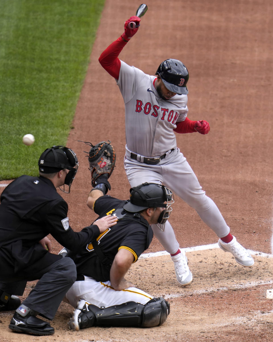 Boston Red Sox's Pablo Reyes, top right, reacts after being hit by a pitch from Pittsburgh Pirates relief pitcher Ryder Ryan (not shown) during the fifth inning of a baseball game in Pittsburgh, Sunday, April 21, 2024. (AP Photo/Gene J. Puskar)