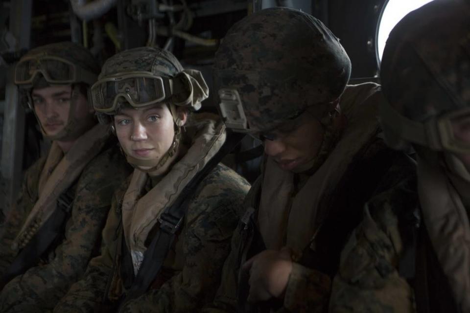 Marine Corps Sgt. Nicole Gee, second from left, a maintenance technician with 24th Marine Expeditionary Unit, awaits the launch April 5, 2021, during a care exercise aboard the USS Iwo Jima. The Department of Defense announced Saturday that Gee was one of 13 American service members killed in an attack Aug. 26 at Hamid Karzai International Airport in Kabul, Afghanistan.