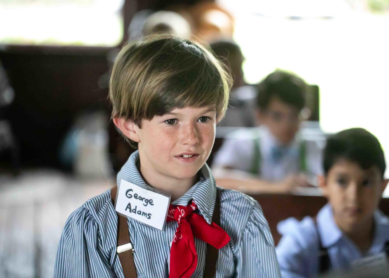 Rosarian Academy fourth grade student George Adams addresses a question from the schoolmarm during a field trip to the Little Red Schoolhouse in Palm Beach Wednesday, March 6, 2024.