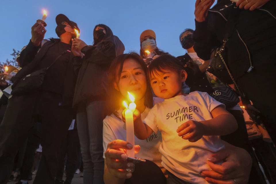 People attend a candlelight vigil outside the Chinese Consulate General in Los Angeles, Friday, June 4, 2022, to mark the 33rd anniversary of the violent suppression of pro-democracy protests in Beijing's Tiananmen Square. (AP Photo/Ringo H.W. Chiu)