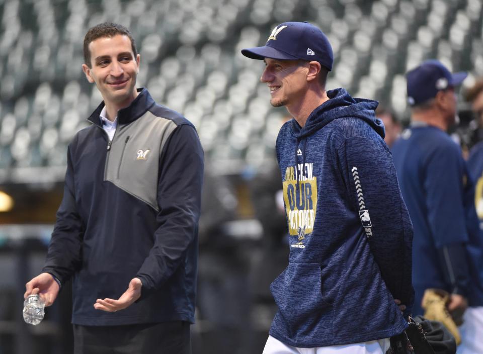 Milwaukee Brewers manager Craig Counsell (right) talks with general manager David Stearns before game one of the 2018 NLDS playoff baseball series against the Colorado Rockies at then-Miller Park in October 2018. Stearns has agreed to become the general manager of the New York Mets, one of his hometown teams.