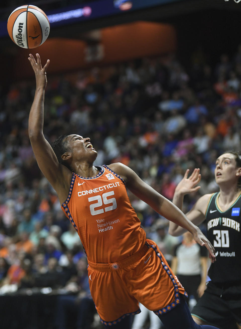 Connecticut Sun's Alyssa Thomas (25) shoots next to New York Liberty's Breanna Stewart (30) during a WNBA basketball game Thursday, Aug. 24, 2023, in Uncasville, Conn. (Sarah Gordon/The Day via AP)