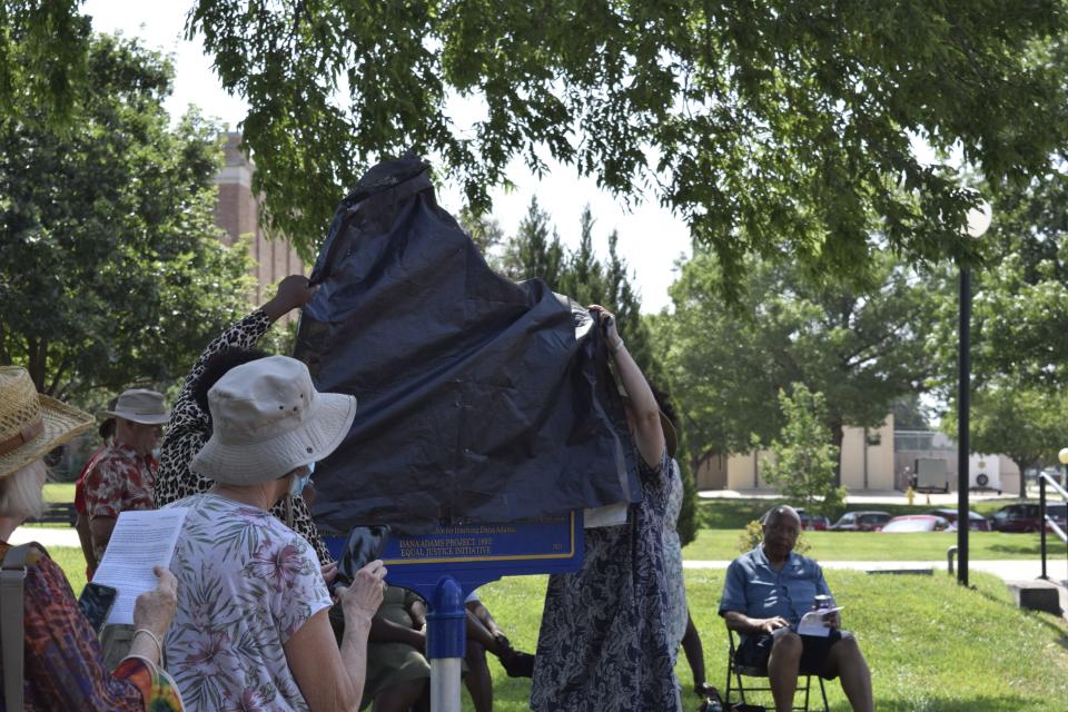 The Revs. Dee Williamston and Martha Murchison unveil the historical marker placed in Robert Caldwell Plaza to recognize the lynching of Dana Adams in 1893 in Salina. The marker was dedicated on Saturday, June 18, by the Dana Adams Project 1893, in collaboration with the Equal Justice Initiative.