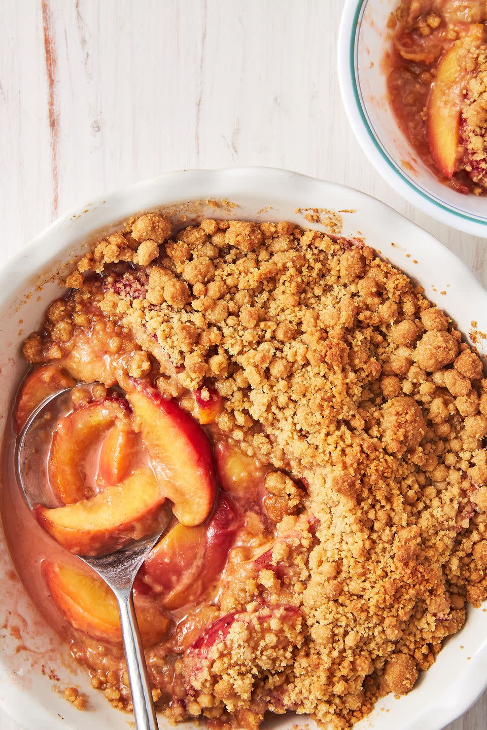 <p>What makes a peach crumble different than a <a href="https://www.delish.com/cooking/recipe-ideas/a27971398/easy-peach-crisp-recipe/" rel="nofollow noopener" target="_blank" data-ylk="slk:peach crisp;elm:context_link;itc:0;sec:content-canvas" class="link ">peach crisp</a> or <a href="https://www.delish.com/cooking/recipe-ideas/a27925395/easy-peach-cobbler-recipe/" rel="nofollow noopener" target="_blank" data-ylk="slk:peach cobbler;elm:context_link;itc:0;sec:content-canvas" class="link ">peach cobbler</a>? It's all in the topping. A crumble is defined by the crumbled, buttery topping usually made out of clumps of butter, flour and sugar. In our crumble, we pile the topping on high so every bite gets a perfect balance of juicy peaches and warm cinnamon topping. </p><p>Get the <strong><a href="https://www.delish.com/cooking/recipe-ideas/a28091638/peach-crumble-recipe/" rel="nofollow noopener" target="_blank" data-ylk="slk:Peach Crumble recipe;elm:context_link;itc:0;sec:content-canvas" class="link ">Peach Crumble recipe</a></strong>. </p>