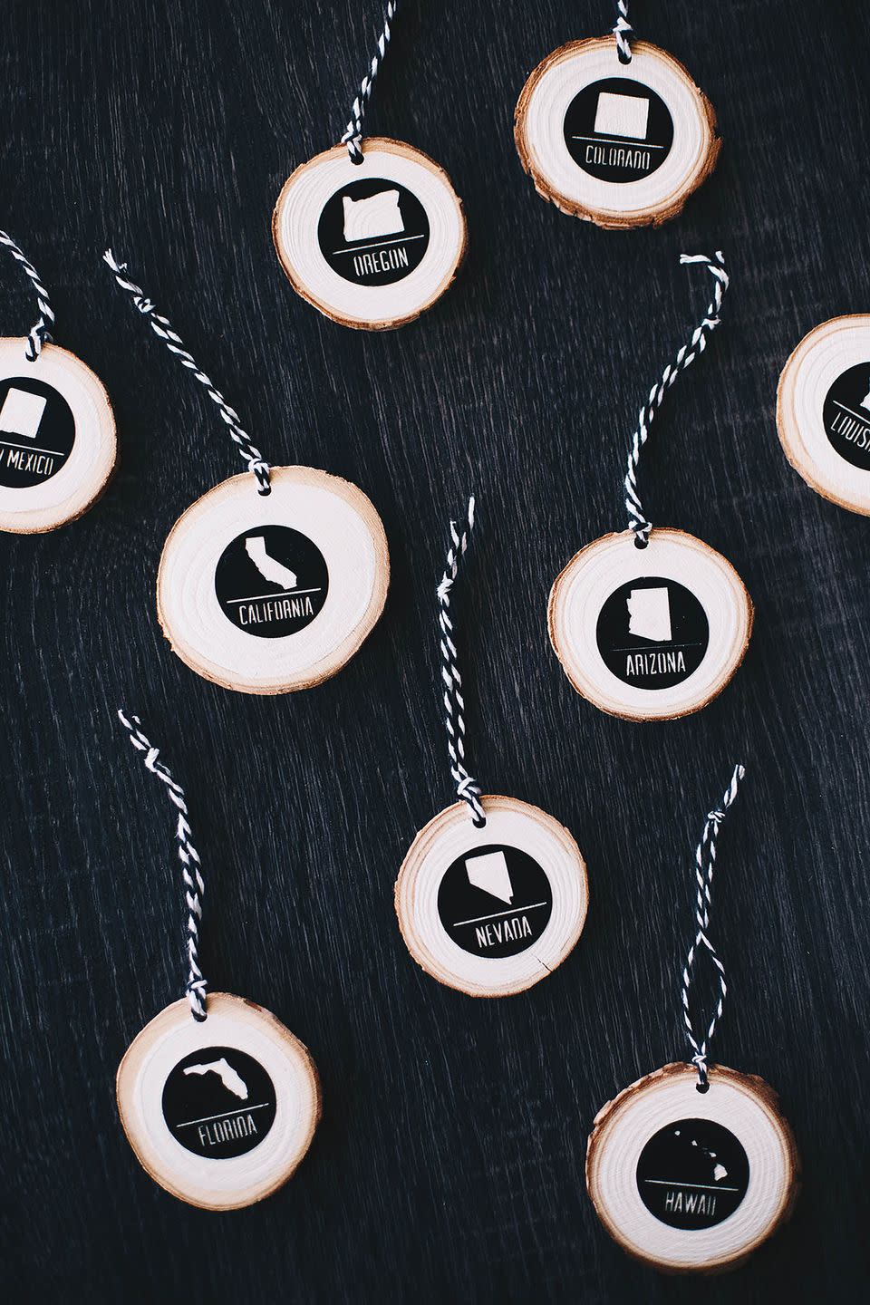<p>Celebrate your family's travels with these ornaments that have painted state decals on each wood slice. We think these also make the perfect gift for friends or family who travel often—and it doesn't have to be limited to states!</p><p><strong>Get the tutorial at <a href="https://allforthememories.com/sponsored-easing-in-to-the-holiday-decor-diy-modern-travel-ornament/" rel="nofollow noopener" target="_blank" data-ylk="slk:All for the Memories" class="link ">All for the Memories</a>.</strong></p><p><strong><a class="link " href="https://www.amazon.com/Fuyit-Unfinished-Predrilled-Christmas-Ornaments/dp/B078HB4ZD7/ref=sr_1_4?tag=syn-yahoo-20&ascsubtag=%5Bartid%7C10050.g.1070%5Bsrc%7Cyahoo-us" rel="nofollow noopener" target="_blank" data-ylk="slk:SHOP WOOD SLICES">SHOP WOOD SLICES</a><br></strong></p>