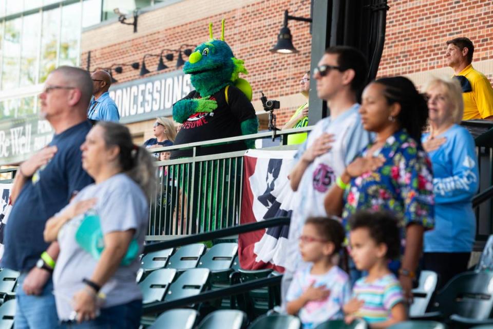 Mason, as performed by The State reporter Chris Trainor, stands for the National Anthem at Segra Park before the Fireflies play the Pelicans on Thursday, April 11, 2024. Joshua Boucher/jboucher@thestate.com