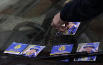 Anti-Brexit leaflets cover the windscreen of a car suspected to be that of a politician, in London, Monday, Oct. 21, 2019. The European Commission says the fact that British Prime Minister Boris Johnson did not sign a letter requesting a three-month extension of the Brexit deadline has no impact on whether it is valid and that the European Union is considering the request. (AP Photo/Kirsty Wigglesworth)