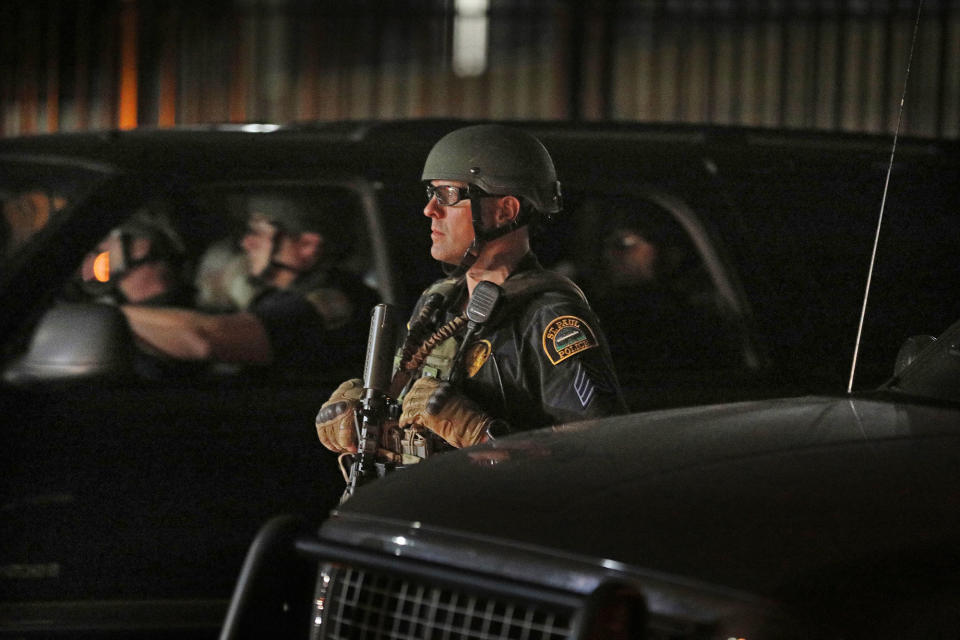 <p>St. Paul, Minn., police stand by after issuing a warning to disperse to demonstrators, Friday night, June 16, 2017 Supporters of Philando Castile held signs as they as they blocked Interstate 94 after leaving a vigil at the state Capitol. A St. Anthony police officer was cleared Friday of all charges in the fatal shooting of Castile last year. (Anthony Souffle/Star Tribune via AP) </p>