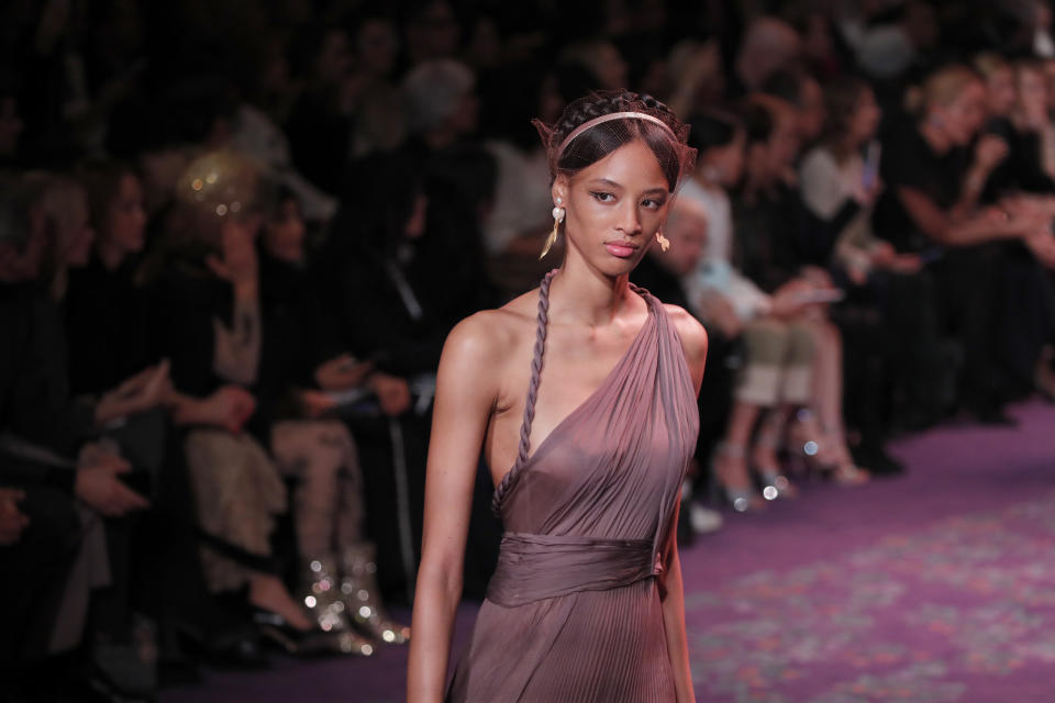 A model wears a creation for the Dior Haute Couture Spring/Summer 2020 fashion collection presented Monday Jan. 20, 2020 in Paris. (AP Photo/Francois Mori)