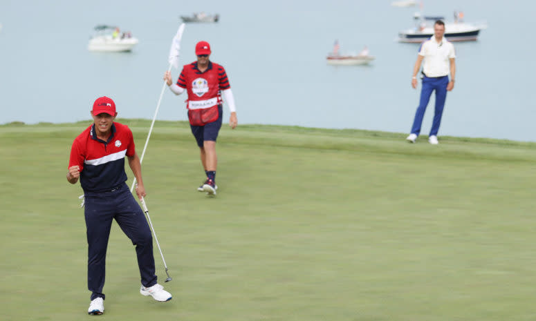 Collin Morikawa celebrates after clinching the Ryder Cup victory for Team USA.