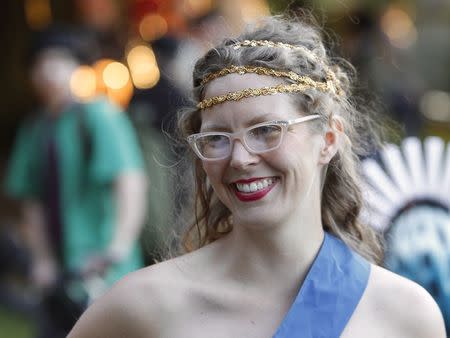 Meghan Sinnott chats as cyclists prepare to pour into the streets of Portland for the 11th annual World Naked Bike Ride June 7, 2014. REUTERS/Steve Dipaola