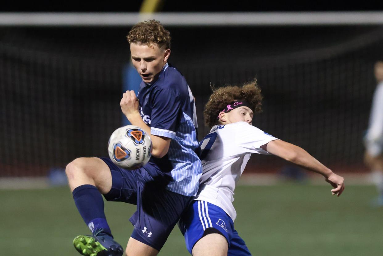 Franklin's Rex Cinelli traps the ball during the Division 1 boys soccer round of 32 game against Attleboro at Franklin High School on Nov. 06, 2023.