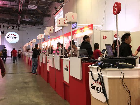 Largest carrier here, SingTel, appeared ready for a big load at its launch event with numerous registration counters.