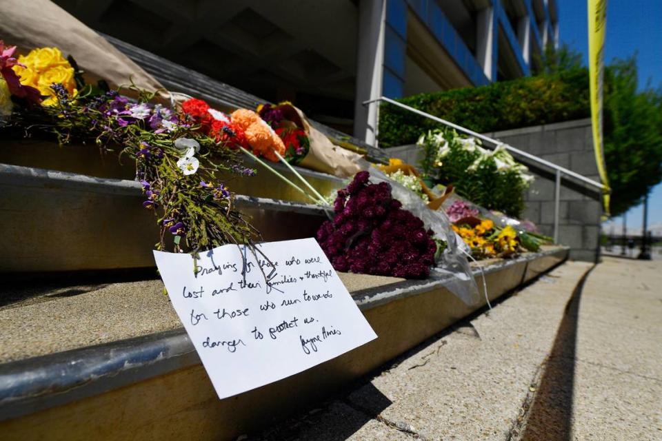 Flowers and a message of hope sit on the steps of the Old National Bank in Louisville, Ky., Tuesday, April 11, 2023. On Monday, a shooting at the bank located in downtown Louisville killed several people and wounded others.