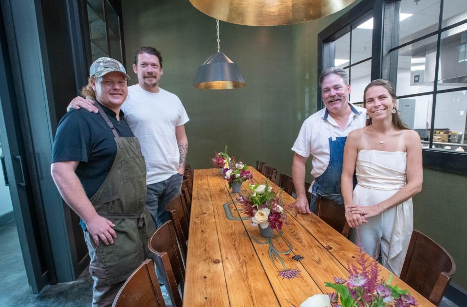 From left, chef de cuisine Taylor Stoll, bar and front of house manager Nate Simmons, chef/owner Blake Rushing and Babs Rushing at the chef's table in the new location of the Union Public House at 36 East Garden Street in Pensacola on Friday, Aug, 25, 2023.