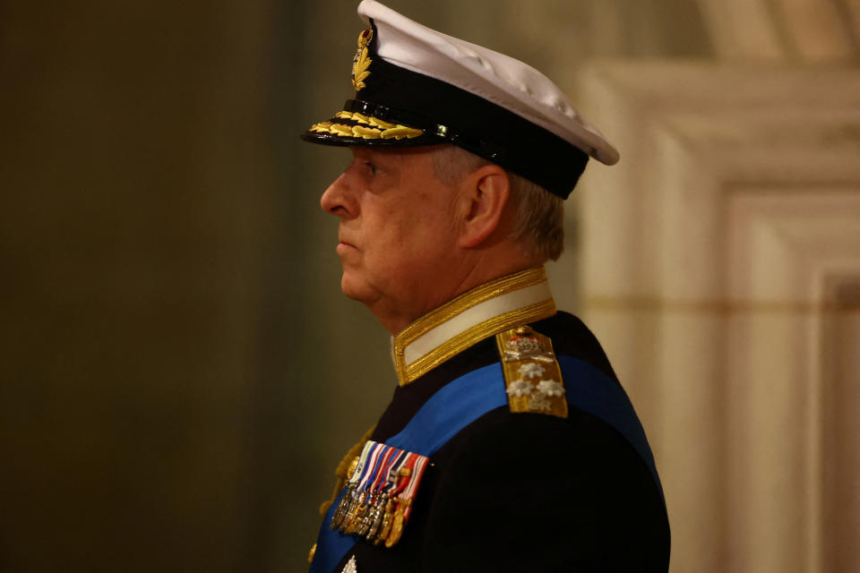 Britain's Prince Andrew, Duke of York attends a  a vigil with his siblings around the coffin of Queen Elizabeth II, draped in the Royal Standard with the Imperial State Crown and the Sovereign's orb and sceptre, lying in state on the catafalque in Westminster Hall, at the Palace of Westminster in London on September 16, 2022, ahead of her funeral on Monday. - Queen Elizabeth II will lie in state in Westminster Hall inside the Palace of Westminster, until 0530 GMT on September 19, a few hours before her funeral, with huge queues expected to file past her coffin to pay their respects. (Photo by HANNAH MCKAY / POOL / AFP) (Photo by HANNAH MCKAY/POOL/AFP via Getty Images)