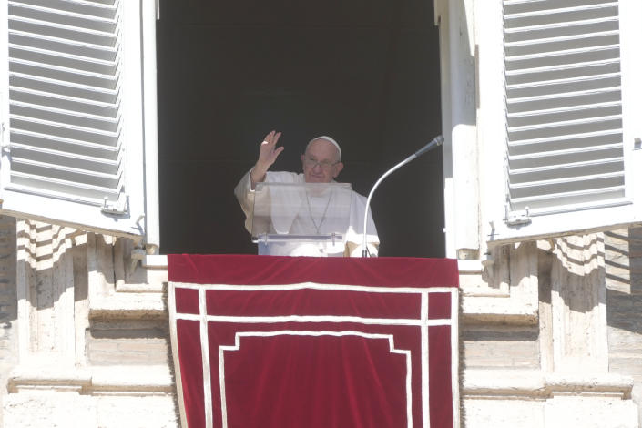 Pope Francis waves to faithful from his studio's window overlooking St. Peter's Square on the occasion of the Angelus noon prayer at the Vatican, Sunday, Oct. 16, 2022.(AP Photo/Gregorio Borgia)