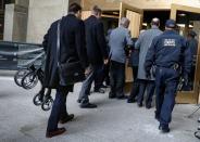 An aide carries a walker for film producer Harvey Weinstein as he arrives at New York Criminal Court for his sexual assault trial in the Manhattan borough of New York