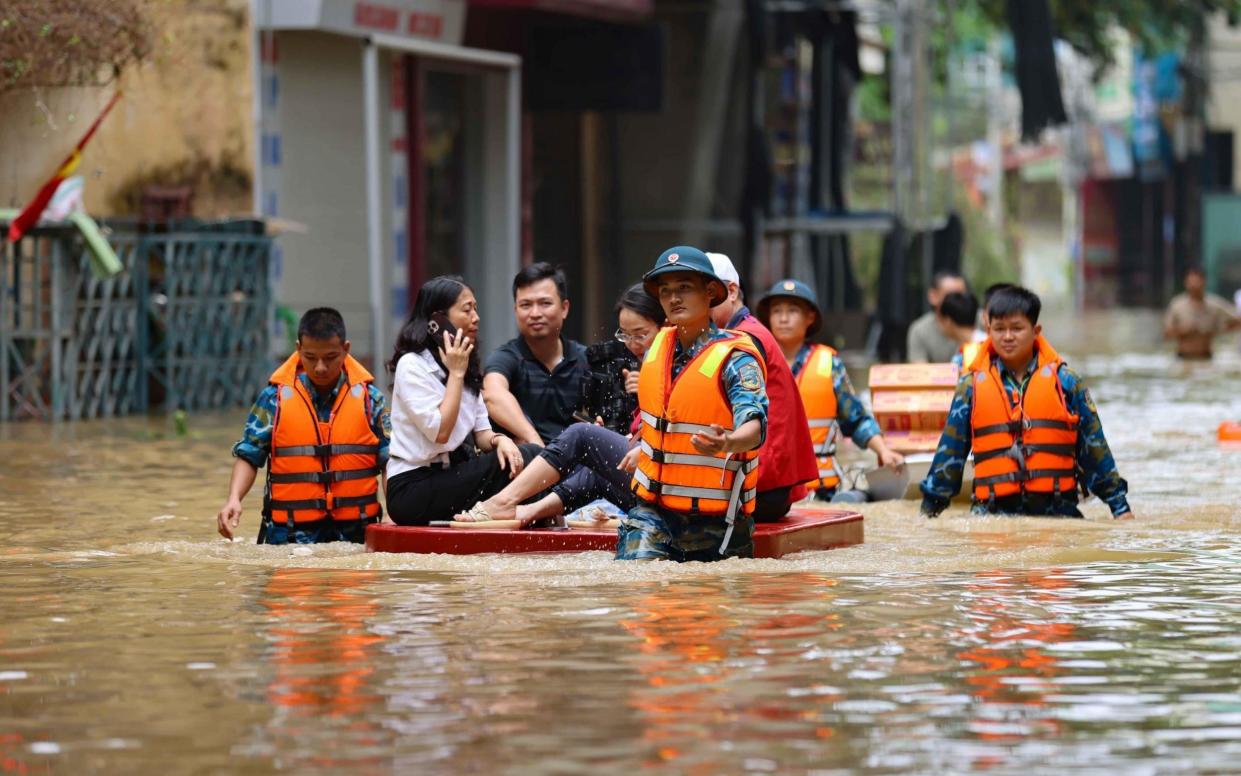 A rescue operation gathers survivors following the typhoon