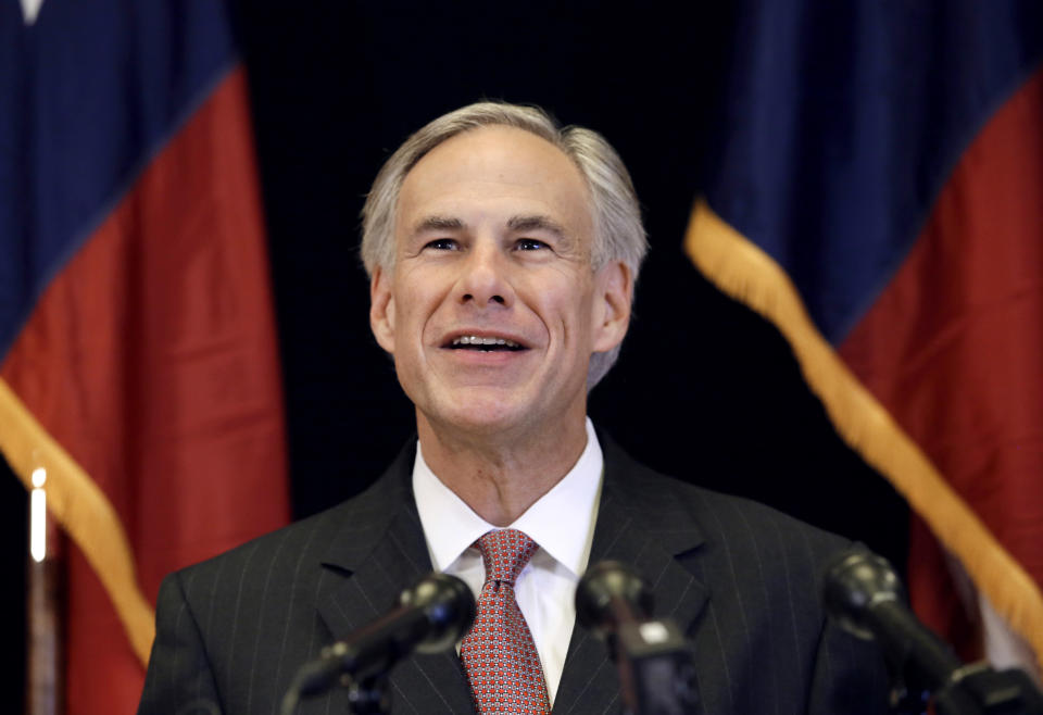 FILE - In this Nov. 4, 2013 file photo, Republican candidate for governor, Texas Attorney General Greg Abbott smiles as he responds to a reporter's questions during a news conference in Dallas. In the nation’s first primary of the season, Texas politicians scramble to fill a void left by an extraordinary shakeup in state offices. (AP Photo/Tony Gutierrez, File)