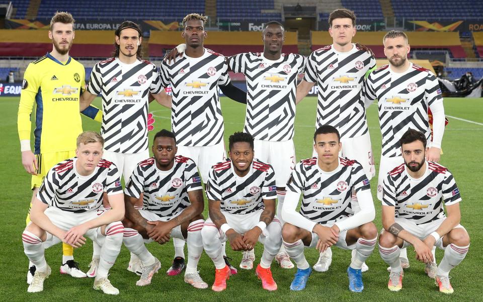 he Manchester United team lines up ahead of the UEFA Europa League Semi-final Second Leg match between AS Roma and Manchester United at Stadio Olimpico on May 06, 2021 in Rome - Matthew Peters/Manchester United via Getty Images