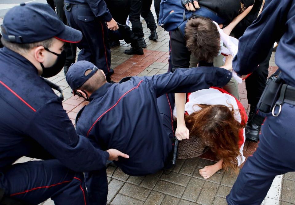 Police detain students during a protest against presidential election results in Minsk, Belarus, Tuesday, Sept. 1, 2020. Several hundred students on Tuesday gathered in Minsk and marched through the city center, demanding the resignation of the country's authoritarian leader after an election the opposition denounced as rigged. Many have been detained as police moved to break up the crowds. (Radio Free Europe/Radio Liberty via AP)