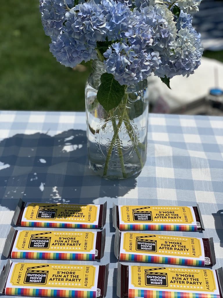 backyard movie night ideas diy chocolate bar tickets on picnic table